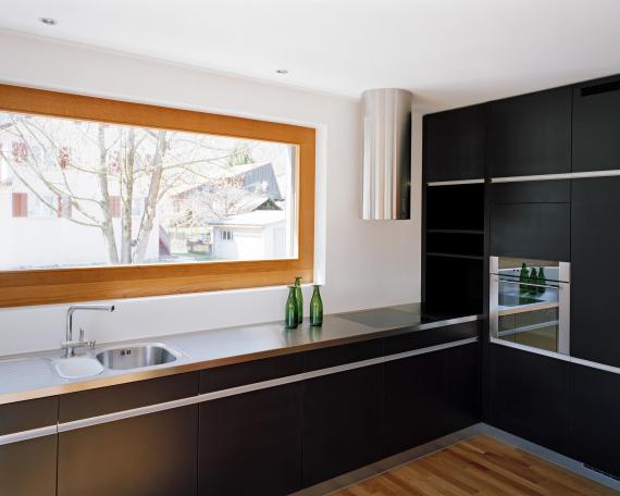 House Niederurnen handcrafted kitchen in black medium density fibreboard