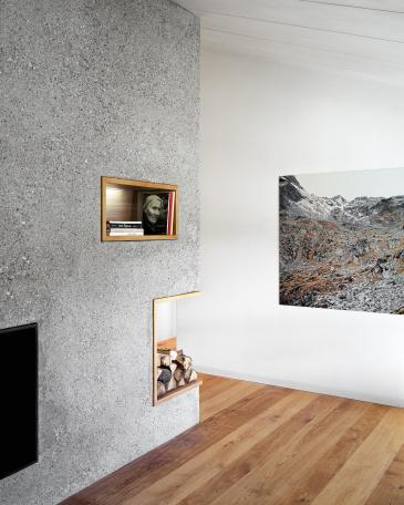 Holiday Home Celerina living room detail bush-hammered concrete and photographs by Jules Spinatsch 