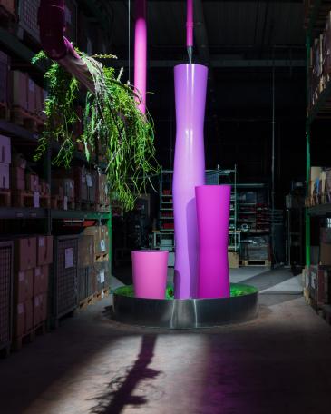 Designers’ Saturday 2014 planters stacked on top of each other creating a fountain sculpture in the high-rack storage of Girsberger 