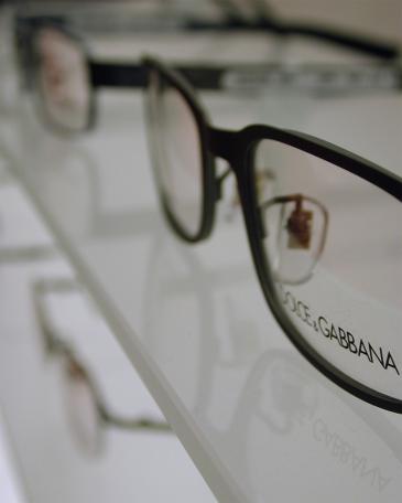 Viegener Optik optician store detail glass shelves from the eyewear display wall 