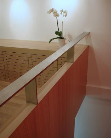 Viegener Optik optician store detail stair railing and storage cabinets for glasses 