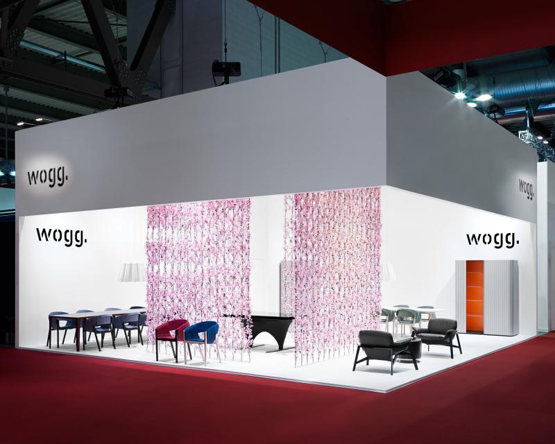 Furniture Fair Milan 2009 exhibition design for Wogg with a cherry blossom curtain in the center of the booth, exhibited furniture from the Amor, Rica and Roya collection 