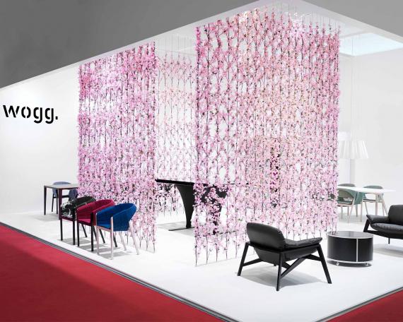 Furniture Fair Milan 2009 exhibition design for Wogg with a cherry blossom curtain in the center of the booth, exhibited furniture from the Amor, Rica and Roya collection 