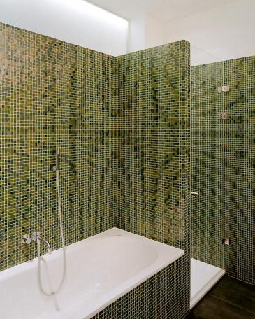 Apartment Zurich bathroom with green mosaic tiles by Bisazza and a toplight